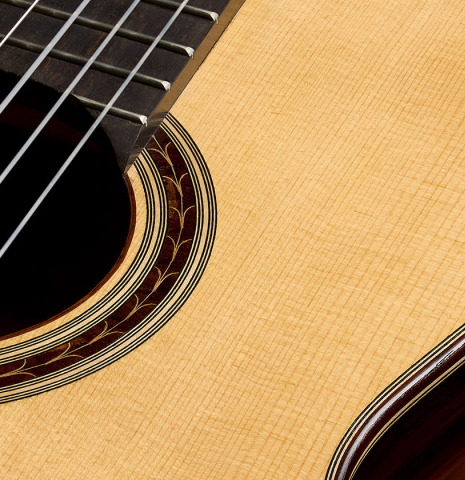 The soundboard and rosette of a 2017 Antonio Raya Pardo "Especial Torres" classical guitar made of spruce and CSA rosewood