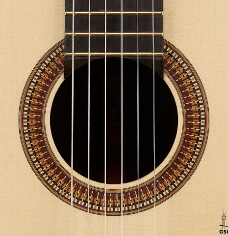 The rosette of a 2026 Richard Reynoso classical guitar made of spruce and Indian rosewood