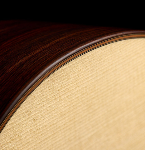 The top binding and purfling of a 2026 Richard Reynoso classical guitar made of spruce and Indian rosewood