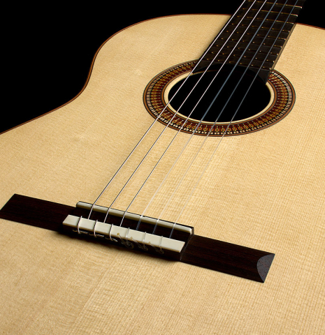 The soundboard as viewed from the lower bout of a 2026 Richard Reynoso classical guitar made of spruce and Indian rosewood