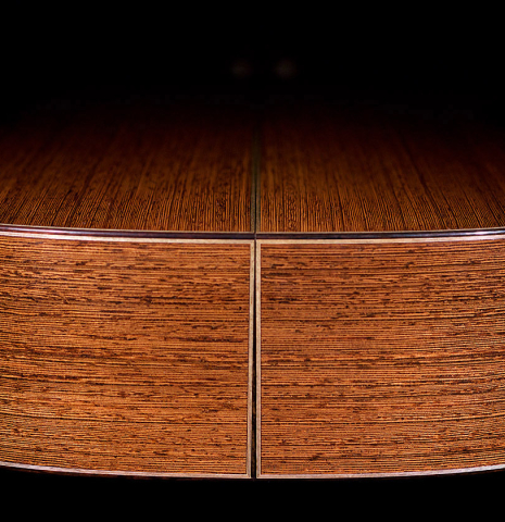 The side of a 2022 Richard Reynoso classical guitar made of spruce and wenge