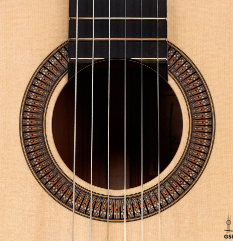 The rosette of a 2022 Richard Reynoso classical guitar made of spruce and pau ferro