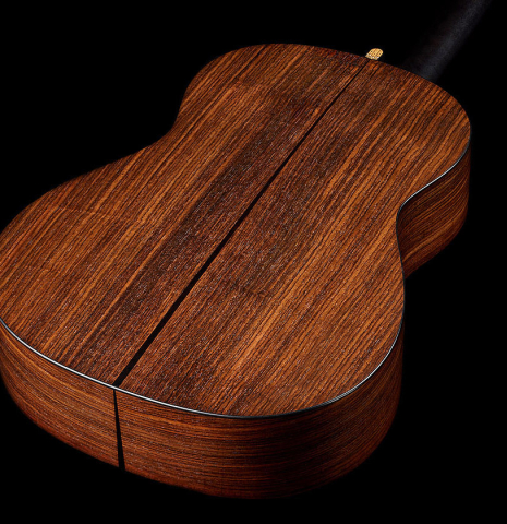 The back and sides of a 2024 Richard Reynoso w/pegs classical guitar made of spruce and Indian rosewood