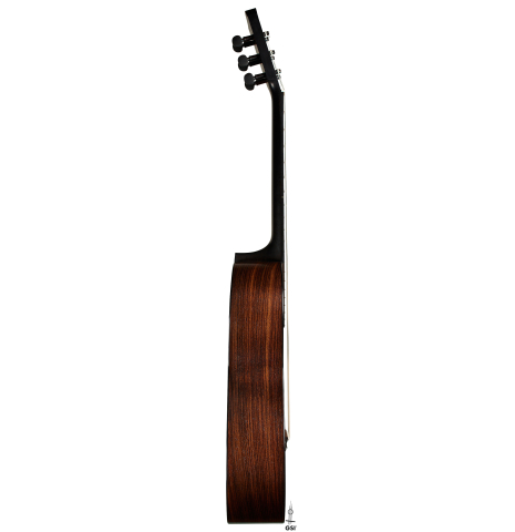 The side of a 2024 Richard Reynoso w/pegs classical guitar made of spruce and Indian rosewood