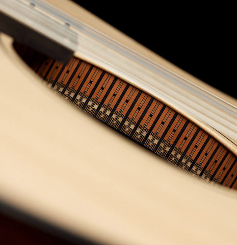 The hanging rosette of a 2024 Richard Reynoso w/pegs classical guitar made of spruce and Indian rosewood