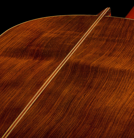 The back center seam of a 1996 Manuel Reyes classical guitar made of cedar and CSA rosewood