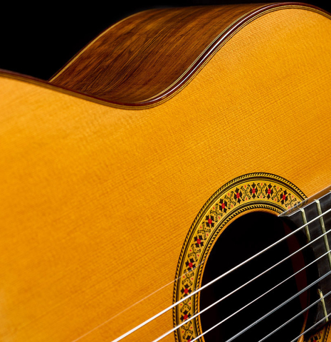The soundboard and side of a 1996 Manuel Reyes classical guitar made of cedar and CSA rosewood