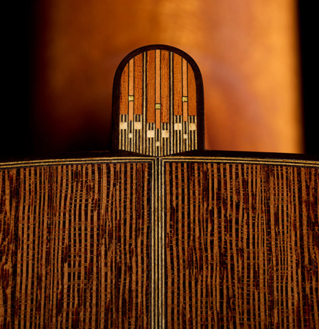 The inlay on the heelcap of a 2023 Richard Reynoso classical guitar made of cedar and wenge