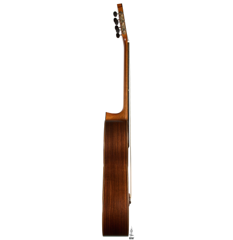 The side of a 2014 Richard Reynoso classical guitar made of cedar and Indian rosewood