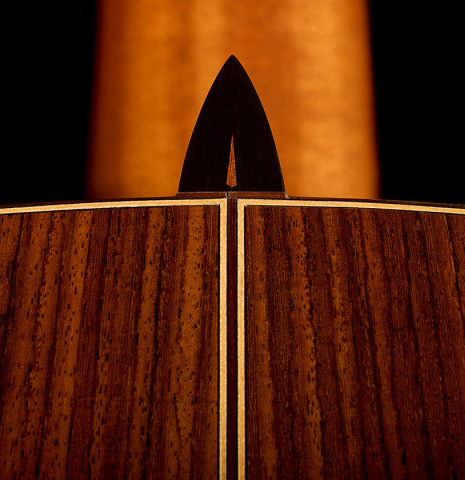 The heel, back binding and purfling of a 2014 Richard Reynoso classical guitar made of cedar and Indian rosewood