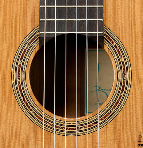The rosette of a 2014 Richard Reynoso classical guitar made of cedar and Indian rosewood