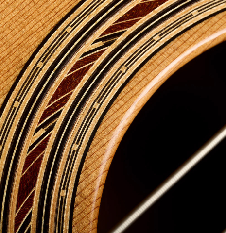 Close-up detail of the rosette of a 2014 Richard Reynoso classical guitar made of cedar and Indian rosewood