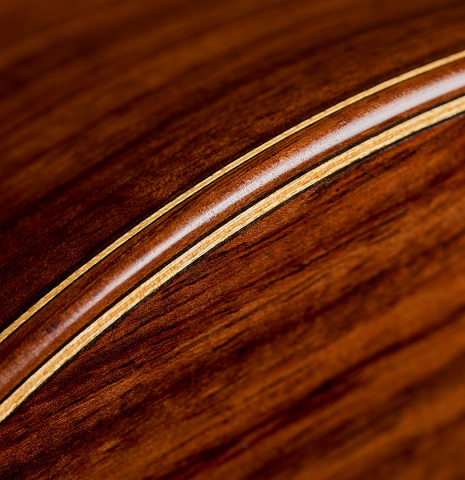 The back and sides binding and purfling of a 2014 Richard Reynoso classical guitar made of cedar and Indian rosewood