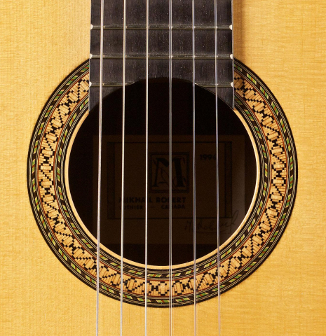 The rosette of a 1996 Mikhail Robert classical guitar made of spruce and Indian rosewood