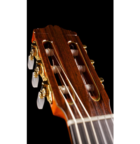 The headstock and tuning machines of a 1996 Mikhail Robert classical guitar made of spruce and Indian rosewood