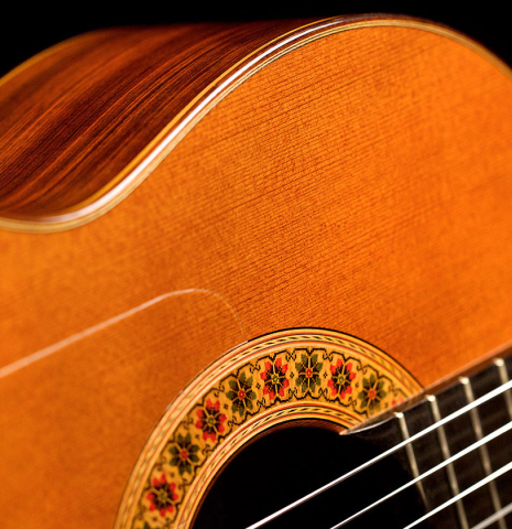 The soundboard and rosette of a 1978 Miguel Rodriguez classical guitar made with redwood and Honduran rosewood