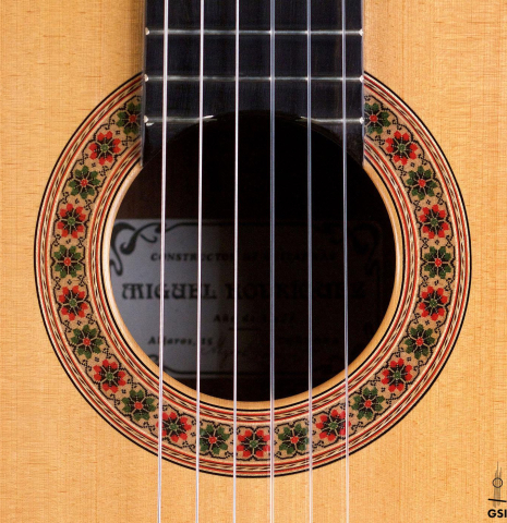 The rosette of a 1987 Miguel Rodriguez classical guitar made of spruce and Honduran rosewood