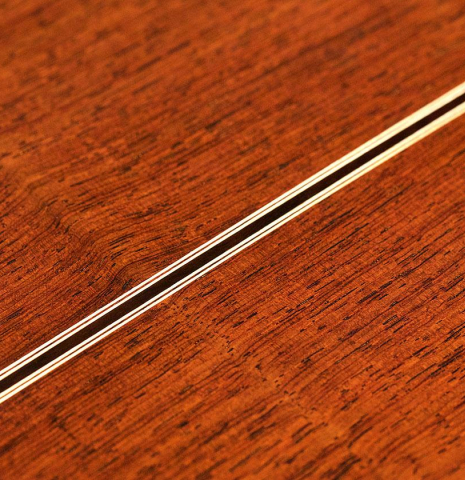 The back of a 1987 Miguel Rodriguez classical guitar made of spruce and Honduran rosewood
