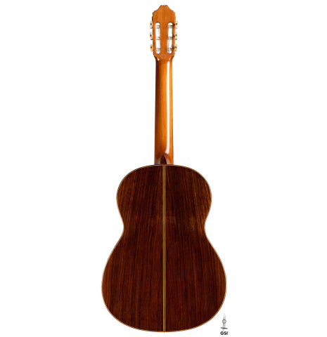 The back of a 1962 Miguel Rodriguez classical guitar on a white background
