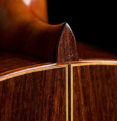 The heel and Indian rosewood back of a 1962 Miguel Rodriguez classical guitar