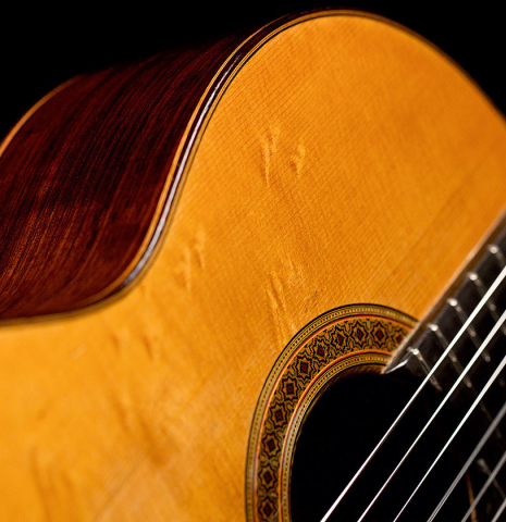 The bearclaw spruce soundboard of a 1962 Miguel Rodriguez classical guitar