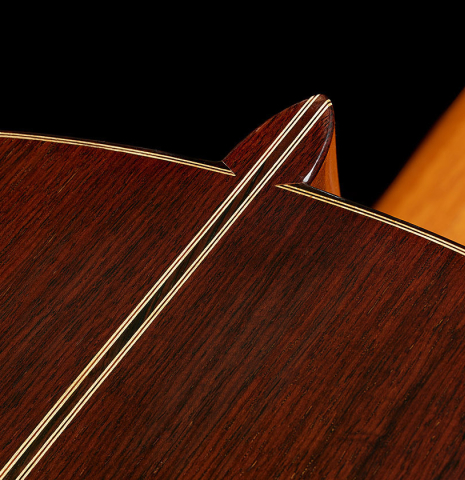 The heel, back binding and purfling of a 1991 Miguel Rodriguez "Centenario" classical guitar made of spruce and CSA rosewood