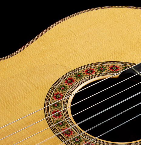 The soundboard and rosette of a 1991 Miguel Rodriguez "Centenario" classical guitar made of spruce and CSA rosewood
