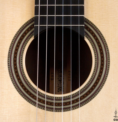 The rosette of a 2021 Jean-Noel Rohe classical guitar made of spruce and CSA rosewood