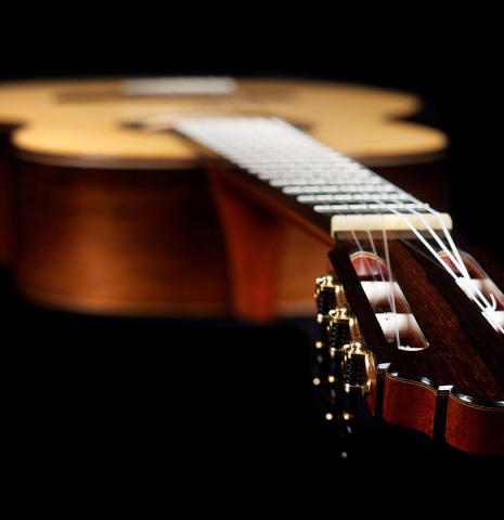The neck and headstock of a 2021 Jean-Noel Rohe classical guitar made of spruce and CSA rosewood