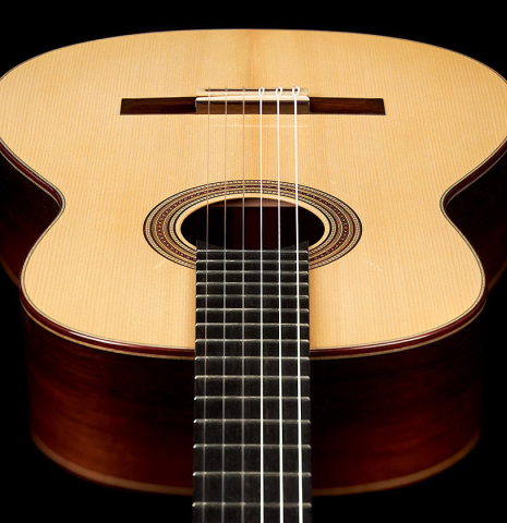 Aerial view of the neck, sides and soundboard of a 2023 Jean-Noel Rohe classical guitar made of spruce and CSA rosewood