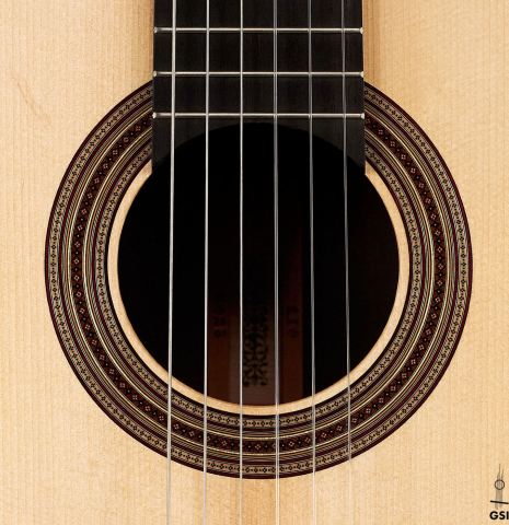 The rosette of a 2023 Jean-Noel Rohe classical guitar made of spruce and CSA rosewood