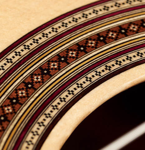 Closeup of the rosette of a 2023 Jean-Noel Rohe classical guitar made of spruce and CSA rosewood