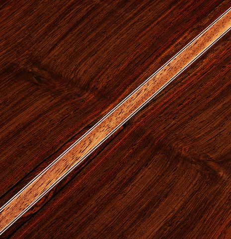 The back center seam of a 2024 Jean-Noel Rohe classical guitar made of spruce and CSA rosewood