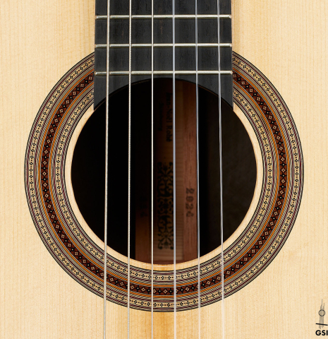 The rosette of a 2024 Jean-Noel Rohe classical guitar made of spruce and CSA rosewood