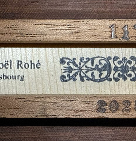 The stamp of a 2025 Jean-Noel Rohe classical guitar made of spruce and CSA rosewood