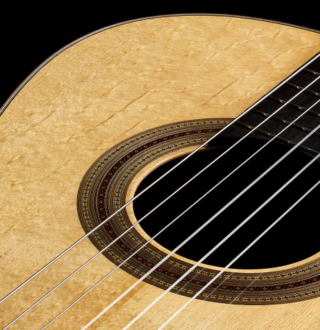 The soundboard and rosette of a 2025 Jean-Noel Rohe classical guitar made of spruce and CSA rosewood