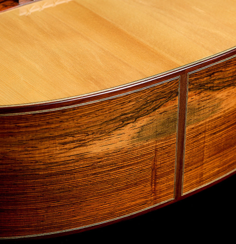 The top and sides at the foot of a 2025 Jean-Noel Rohe classical guitar made of spruce and CSA rosewood