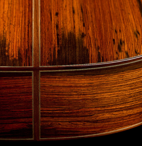 The back and sides at the foot of a 2026 Jean-Noël Rohé classical guitar made of spruce and CSA rosewood