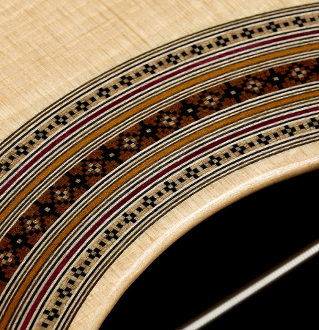 Detailed close-up of the rosette of a 2026 Jean-Noël Rohé classical guitar made of spruce and CSA rosewood