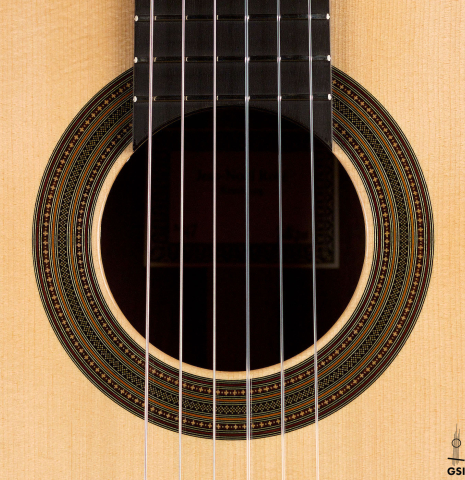 The rosette of a 2011 Jean-Noel Rohe classical guitar made of spruce and Indian rosewood