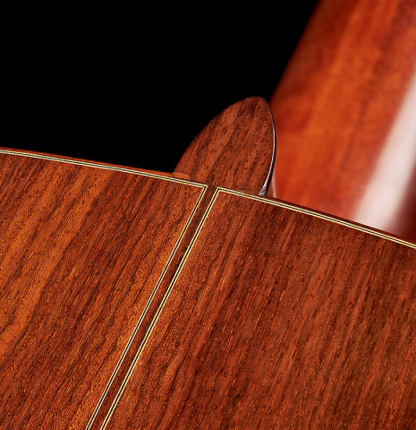 The heel and back purflings of a 2003 Jean-Noel Rohe classical guitar made of spruce and Indian rosewood