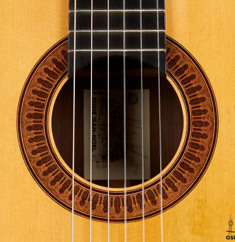 The rosette of a 2003 Jean-Noel Rohe classical guitar made of spruce and Indian rosewood