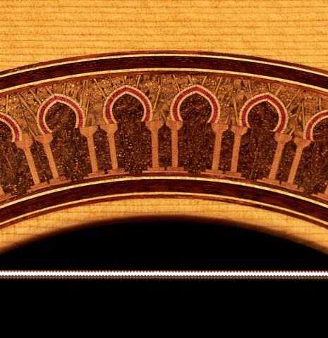 Close-up detail of the rosette of a 2003 Jean-Noel Rohe classical guitar made of spruce and Indian rosewood