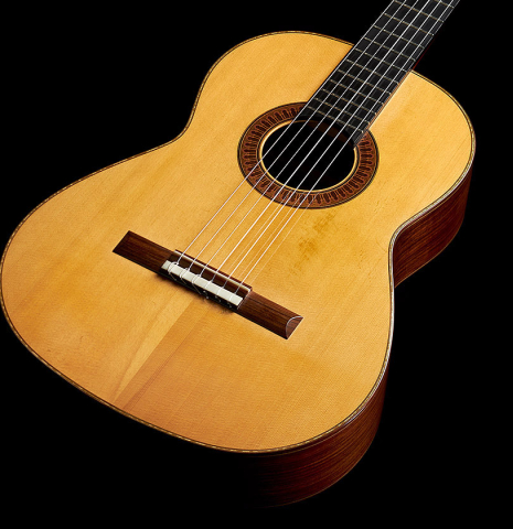 The soundboard of a 2003 Jean-Noel Rohe classical guitar made of spruce and Indian rosewood