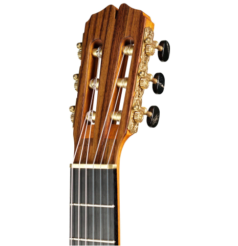 The headstock of a 2015 Pepe Romero "Centenario" classical guitar made with cedar soundboard and CSA rosewood back and sides on a white background