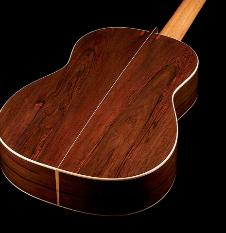 The back and sides of a 2024 Pepe Romero classical guitar made of cedar and CSA rosewood