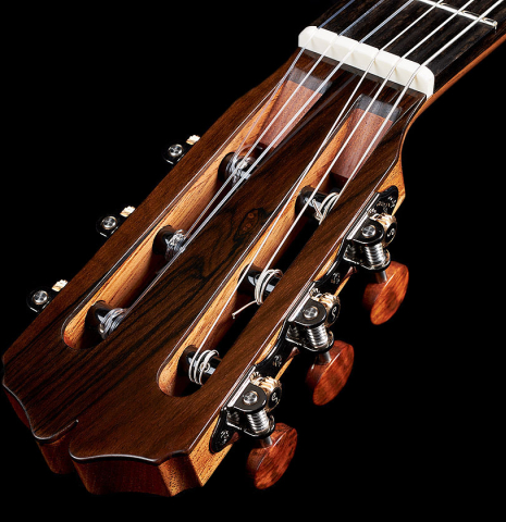 The headstock and tuning machines of a 2024 Pepe Romero classical guitar made of cedar and CSA rosewood