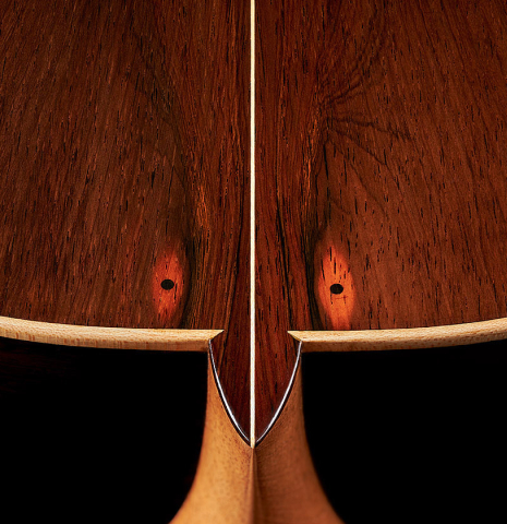 The heel and back binding of a 2024 Pepe Romero classical guitar made of cedar and CSA rosewood