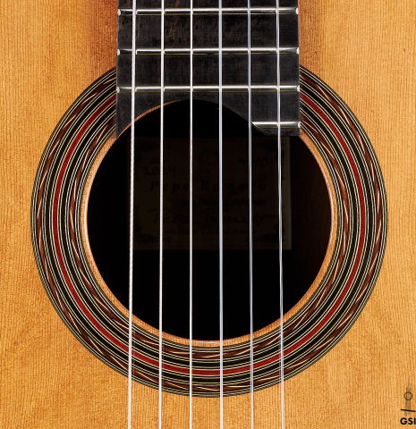The rosette of a 2024 Pepe Romero classical guitar made of cedar and CSA rosewood