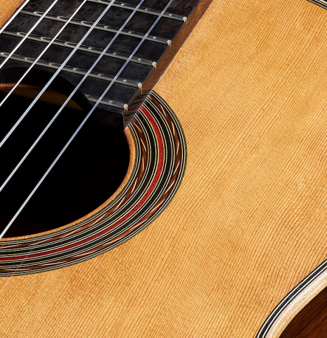 The soundboard of a 2024 Pepe Romero classical guitar made of cedar and CSA rosewood